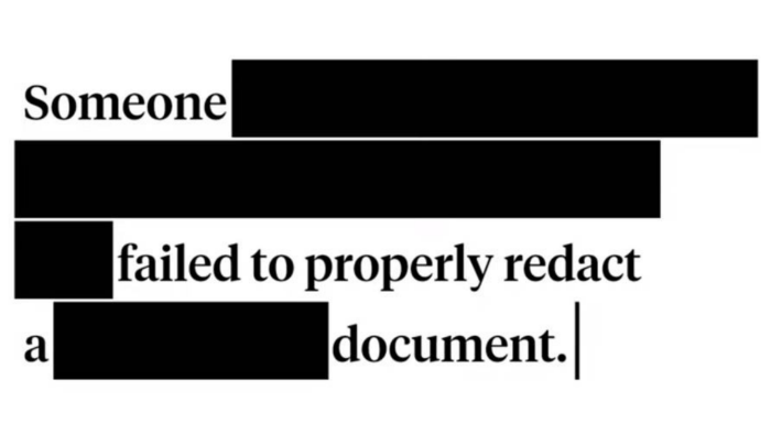 A close-up view of a document with redacted text, but with sensitive information still visible, highlighting the dangers of improper redaction.